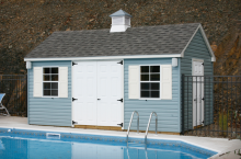 Standard Cape Cod 10′ x 16′ with slate blue vinyl siding and cupola