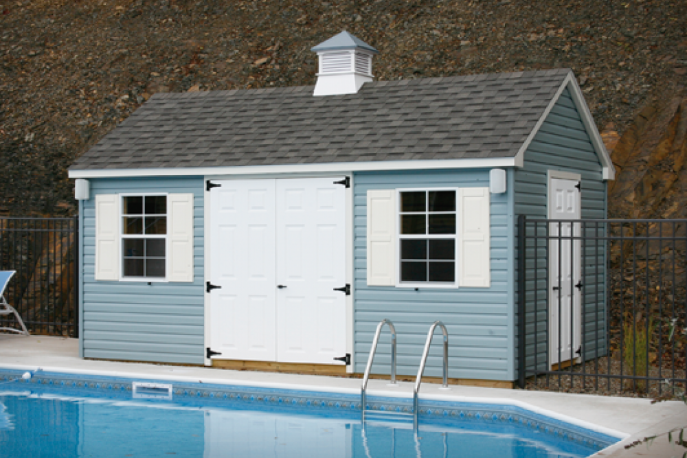 Standard Cape Cod 10′ x 16′ with slate blue vinyl siding and cupola